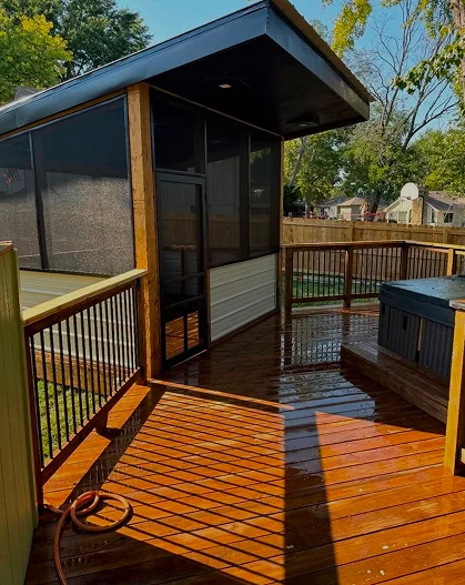 Screened deck with stained decking and black railing