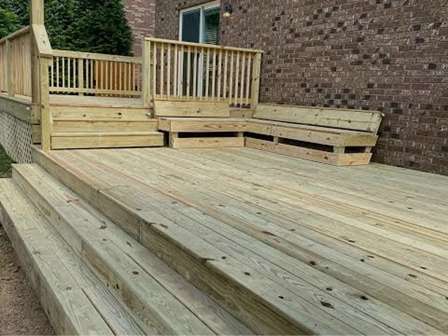 Pressure-treated deck with built-in bench seating and wide steps