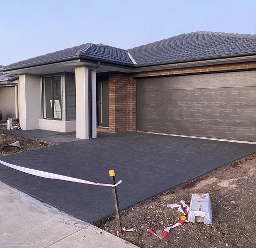 Newly finished driveway in front of a double garage