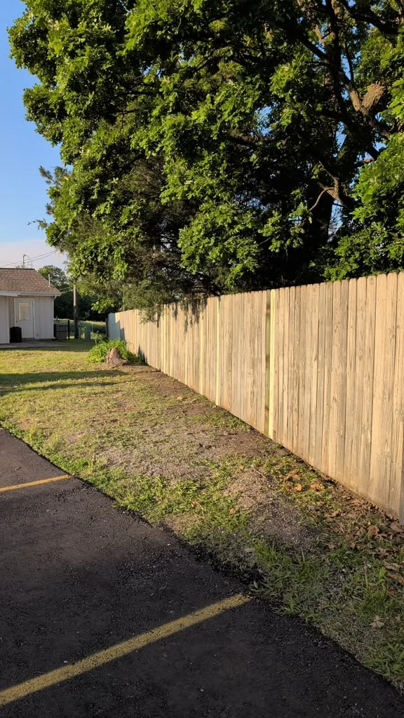 Cedar picket property line fence